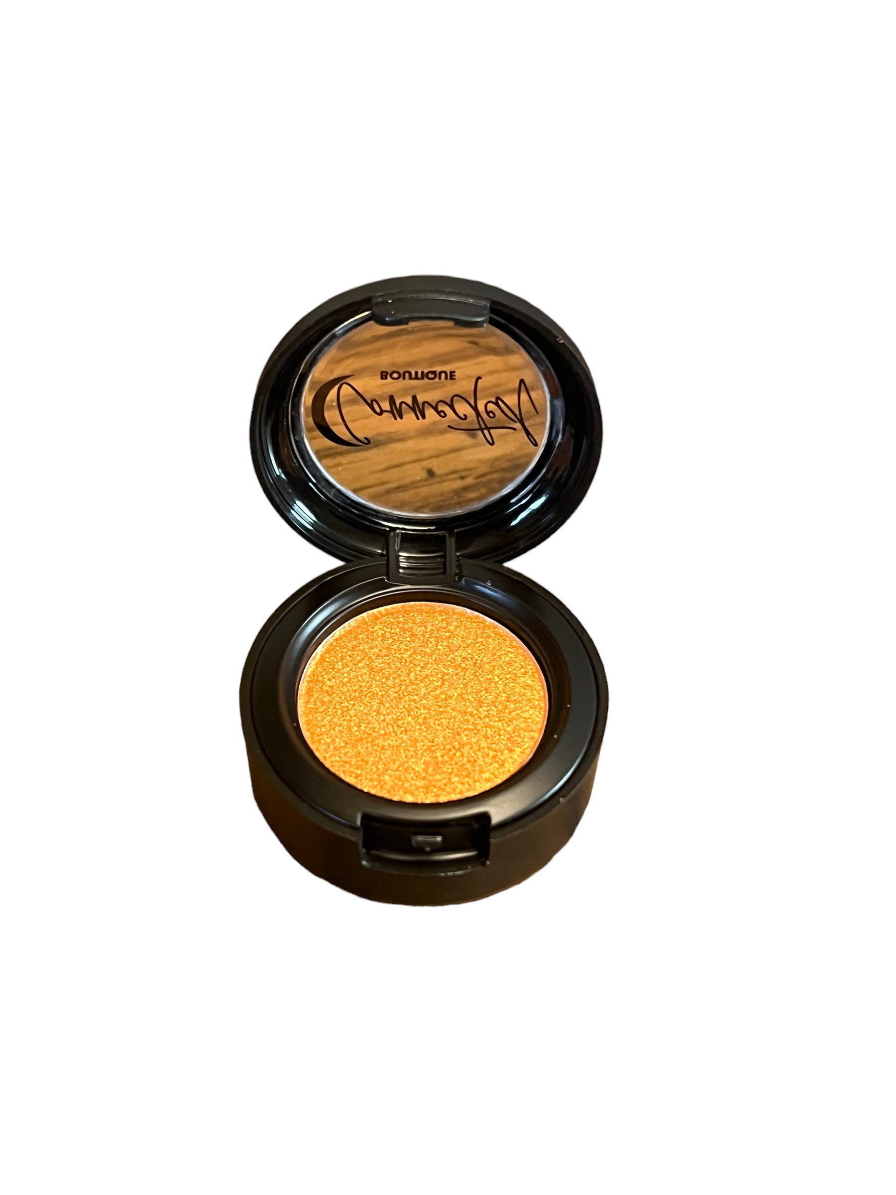 “Astral Kiss” orange shimmer single eyeshadow